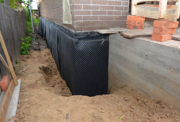 Happy homeowners after waterproofing job in Marcellus